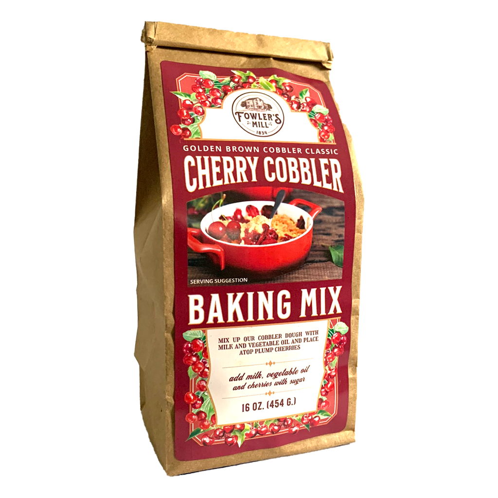 Front of Fowler's Mill Cherry Cobbler Mix kraft paper bag with glossy label with a pile of cherries and a dish of cherry cobbler