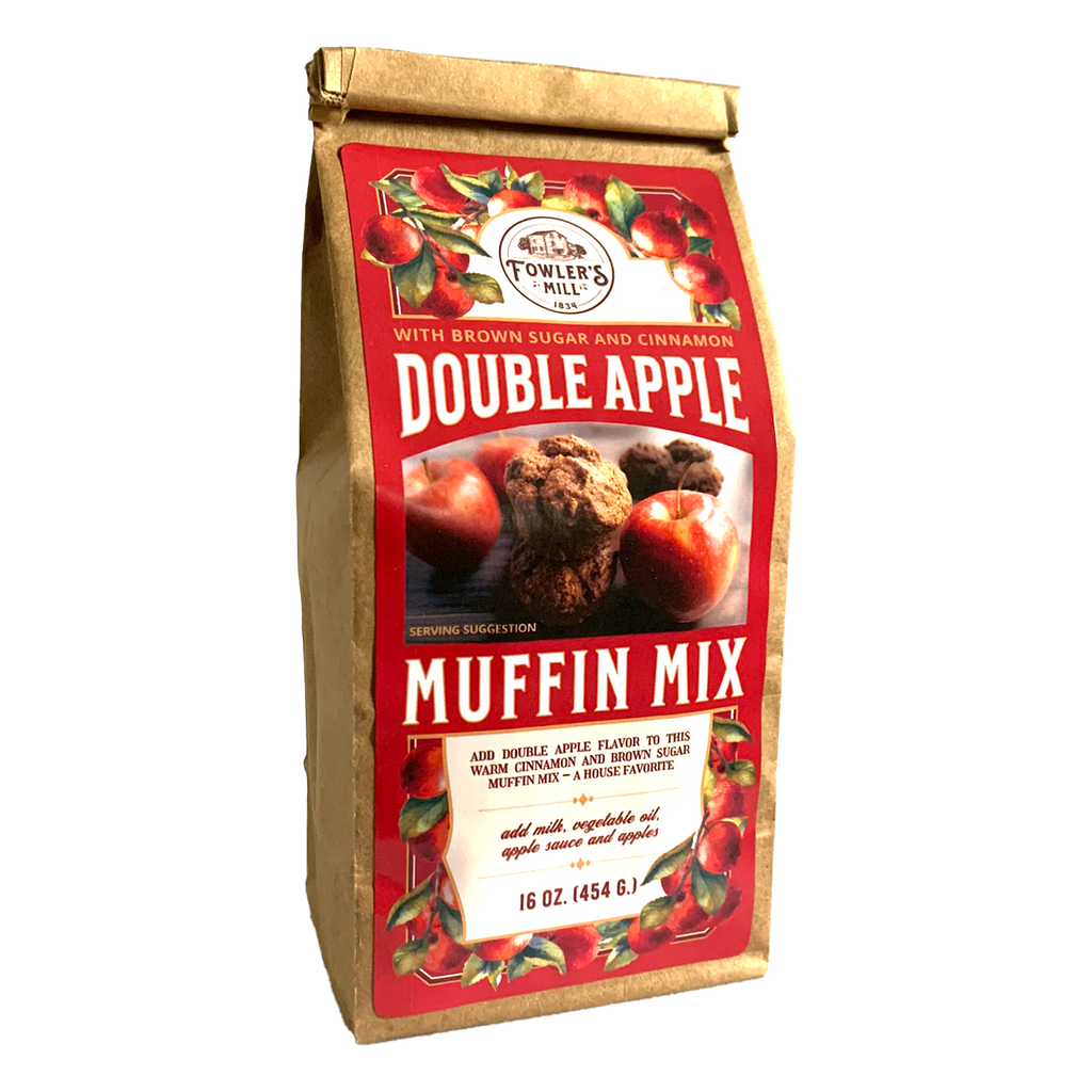 Front of Fowler's Mill Double Apple Muffin Mix kraft paper bag with glossy label including a pile of fresh apples and a stack of apple muffins