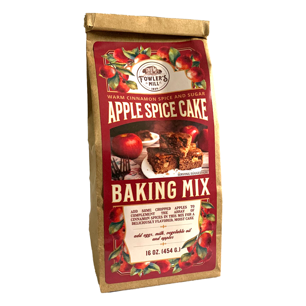 Front of Fowler's Mill Apple Spice Cake Mix kraft paper bag with glossy label including apples and a yummy slice of apple spice cake on a red plate.
