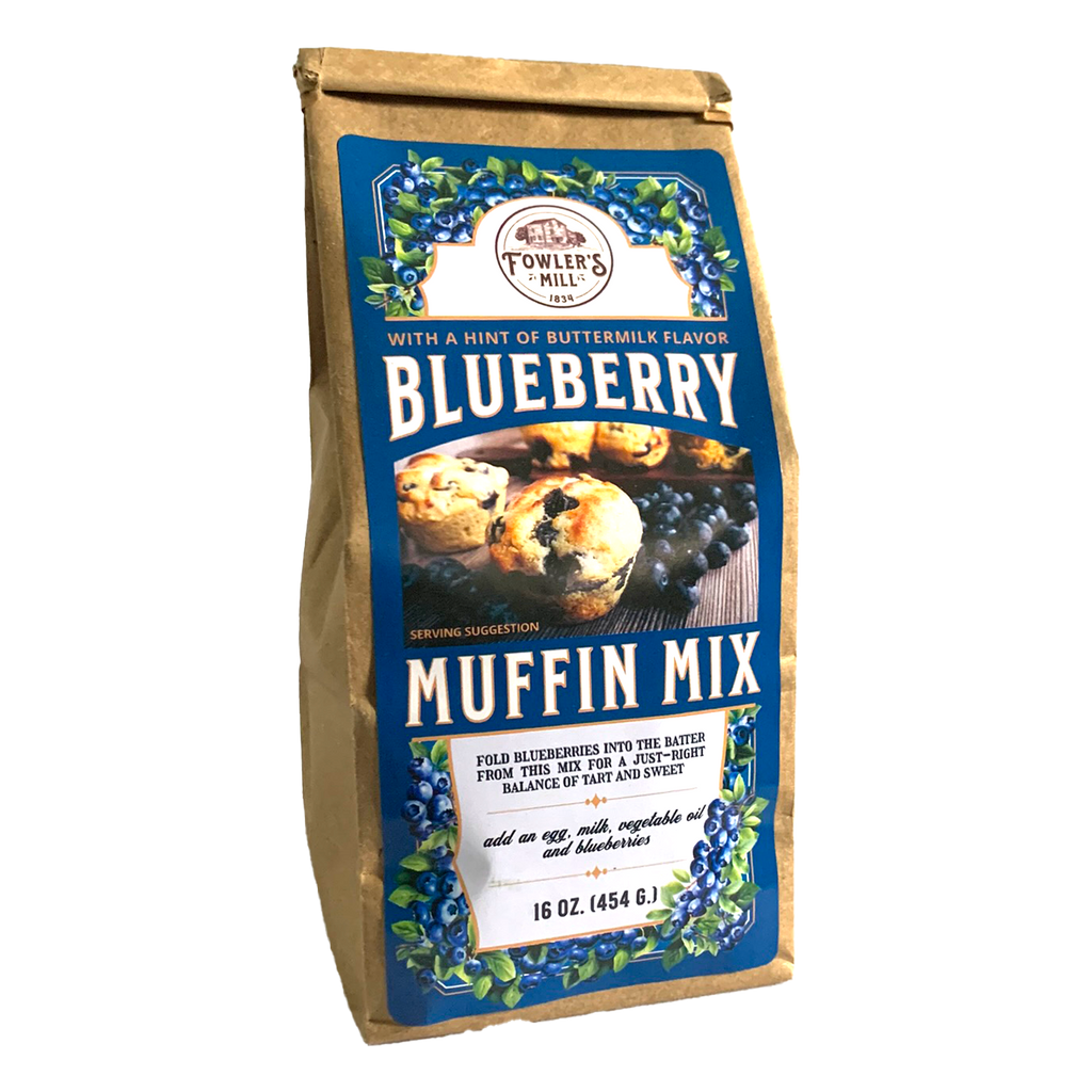 Front of Fowler's Mill Blueberry Muffin Mix paper bag with glossy label including a pile of blueberries and several blueberry muffins