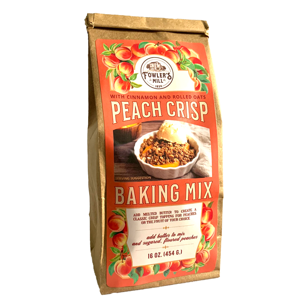 Front of Fowler's Mill Peach Crisp Mix kraft paper bag with glossy label including a pile of peaches and peach crisp in a white ramekin with ice cream..