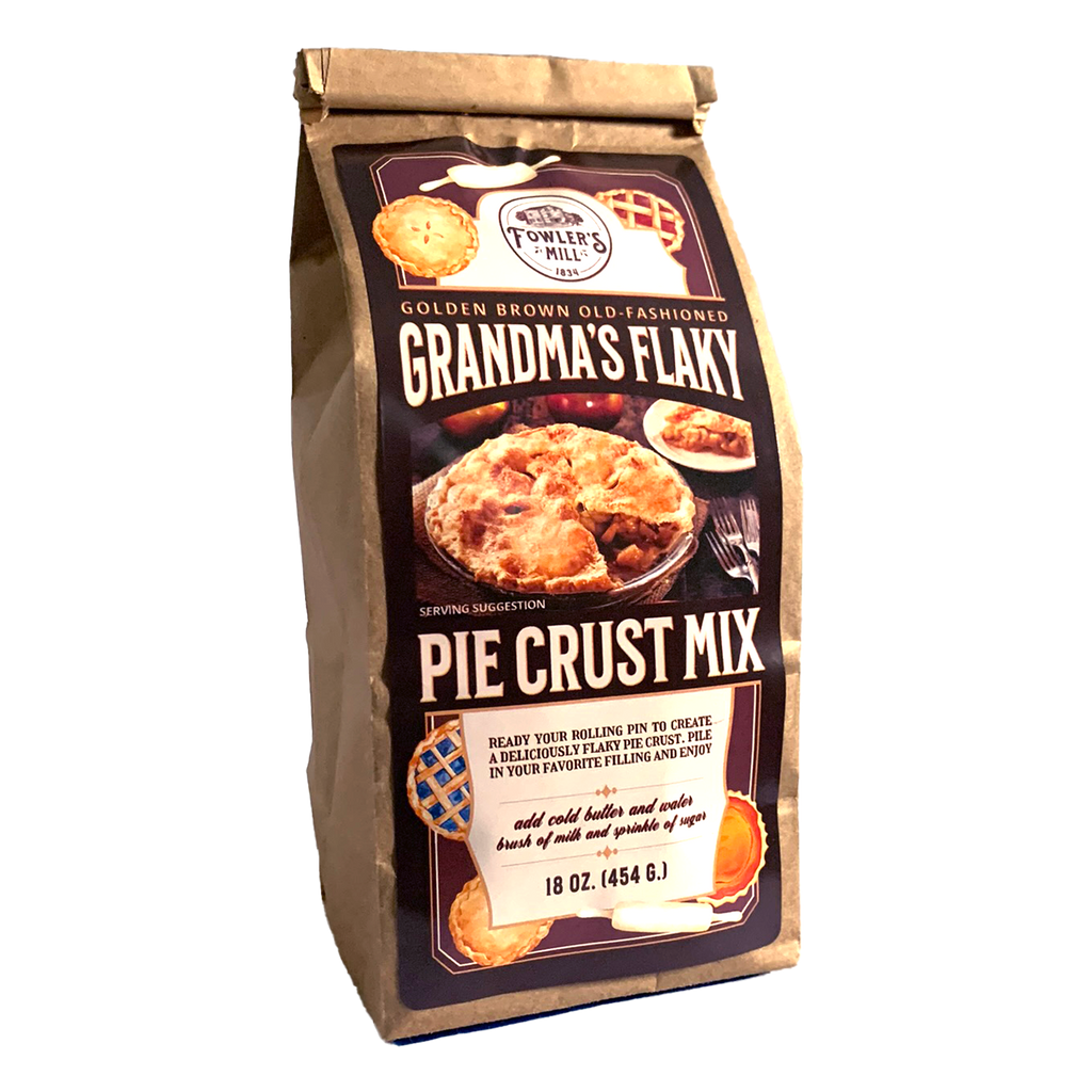 Front side of Fowler's Mill Grandma's Flaky Pie Crust Mix kraft paper bag with glossy logo featuring different types of pies.