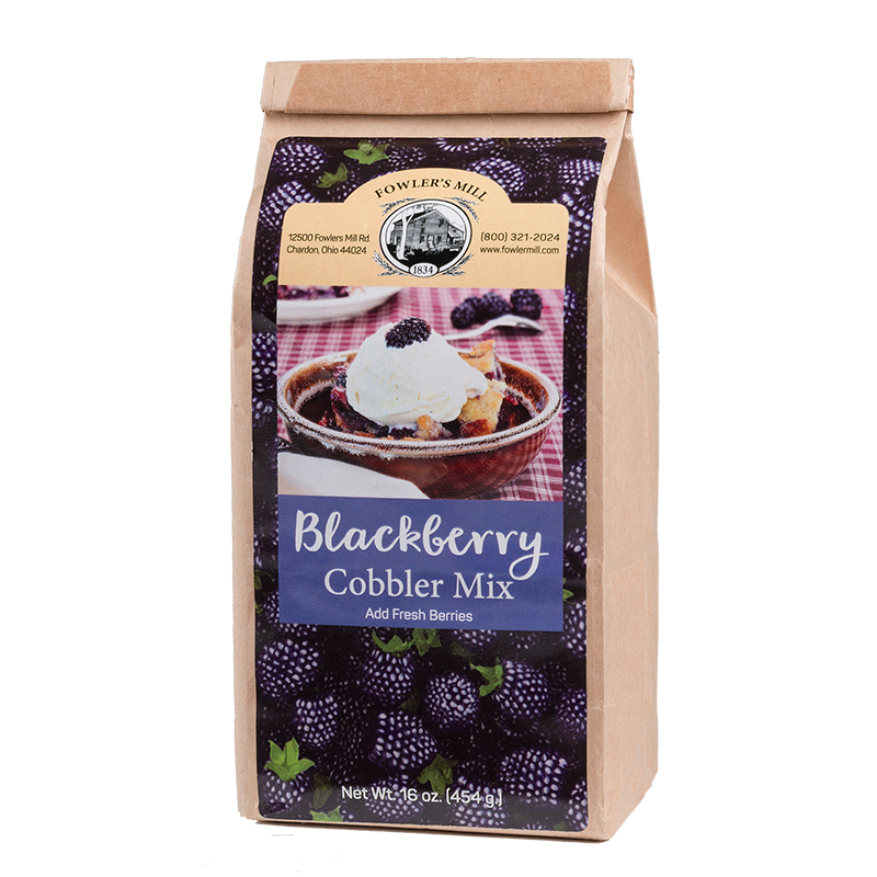 Front of Fowler's Mill Blackberry Cobbler Mix paper bag with glossy label including blackberries and a blackberry cobbler with vanilla ice cream